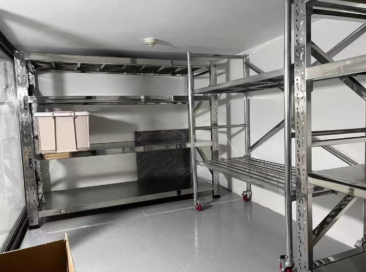 Stainless steel storage shelving photographed in a partner workshop for fitout reference