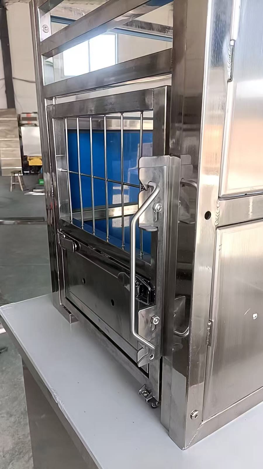 Custom stainless steel kennel door with configurable latch hardware